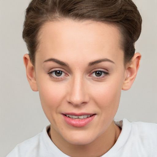 Joyful white young-adult female with short  brown hair and brown eyes