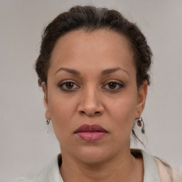 Joyful white adult female with short  brown hair and brown eyes