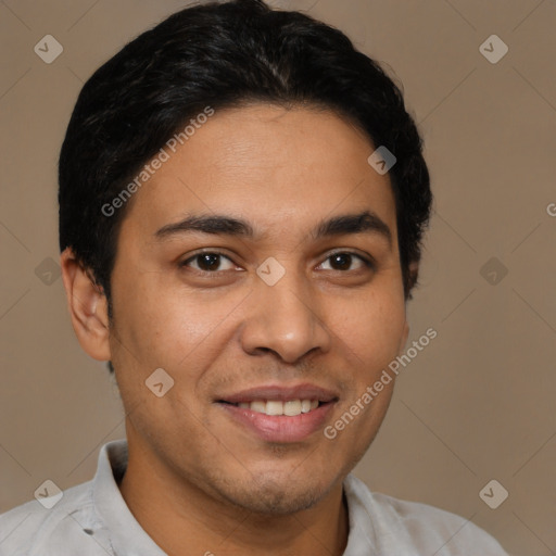 Joyful latino young-adult male with short  brown hair and brown eyes