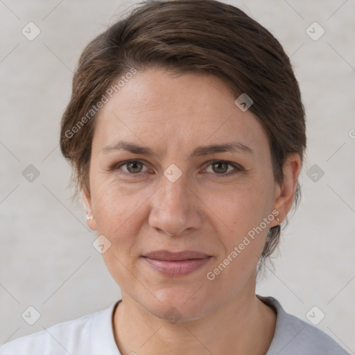 Joyful white adult female with short  brown hair and brown eyes