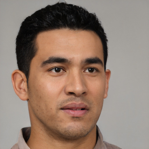Neutral latino young-adult male with short  black hair and brown eyes