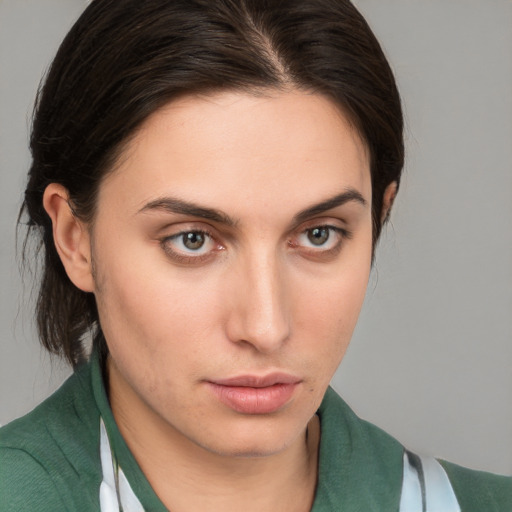 Neutral white young-adult female with medium  brown hair and brown eyes