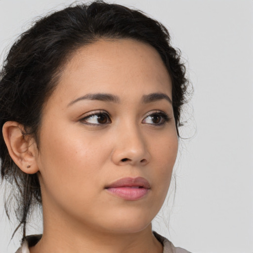 Neutral latino young-adult female with medium  brown hair and brown eyes