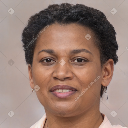 Joyful black adult female with short  brown hair and brown eyes