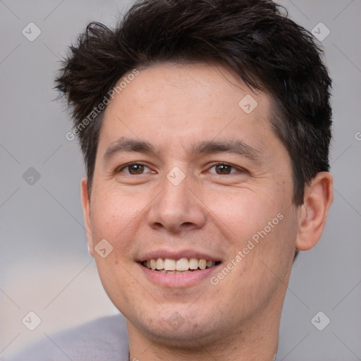 Joyful white adult male with short  brown hair and brown eyes