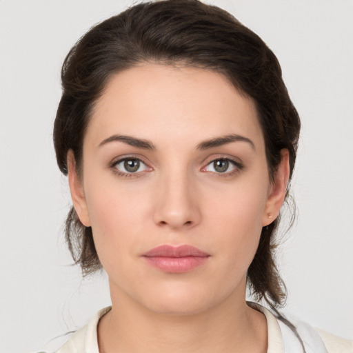 Neutral white young-adult female with medium  brown hair and brown eyes