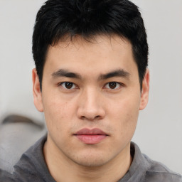 Neutral asian young-adult male with short  brown hair and brown eyes