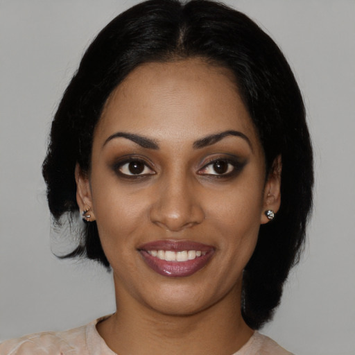 Joyful latino young-adult female with medium  black hair and brown eyes