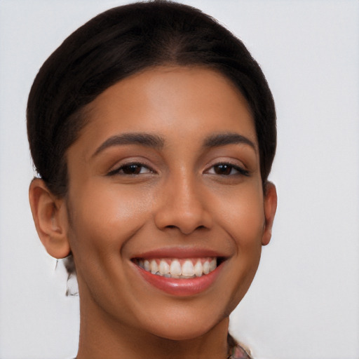 Joyful latino young-adult female with short  brown hair and brown eyes