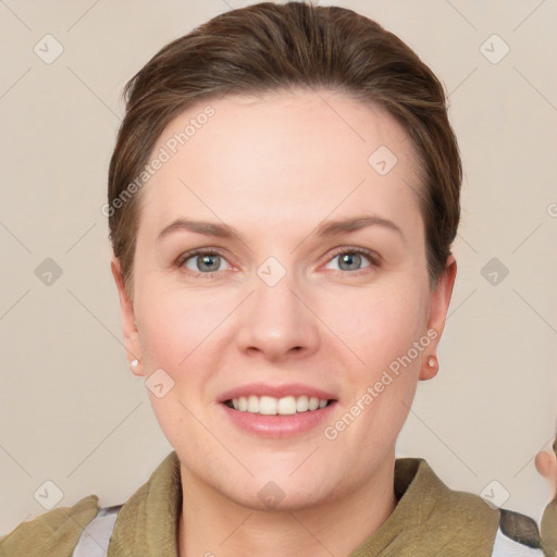 Joyful white young-adult female with short  brown hair and grey eyes