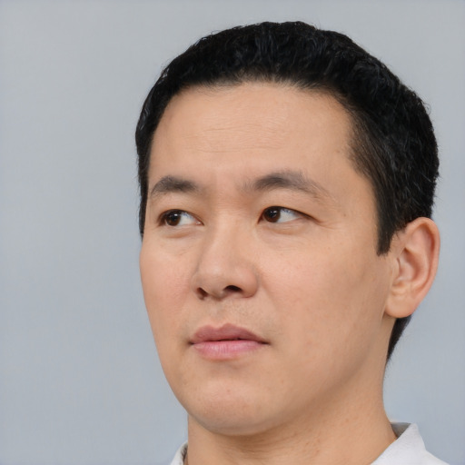 Neutral asian young-adult male with short  black hair and brown eyes