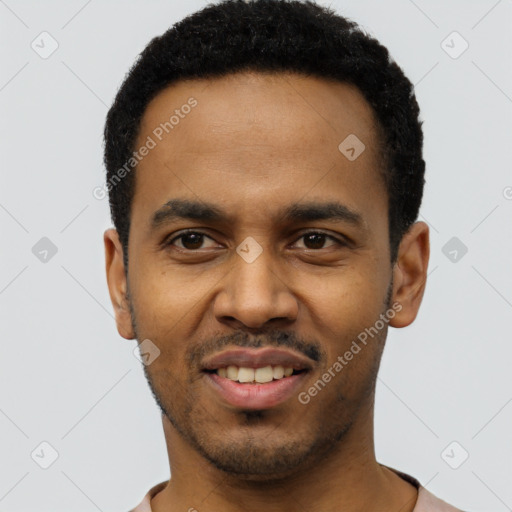 Joyful black young-adult male with short  black hair and brown eyes