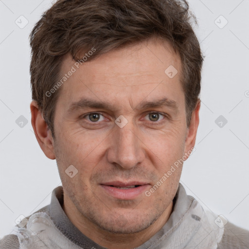 Joyful white adult male with short  brown hair and grey eyes