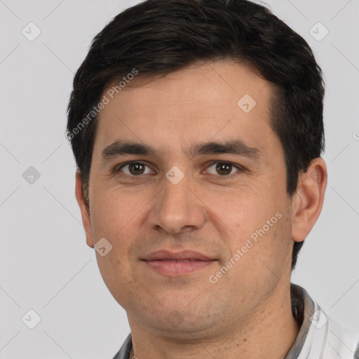 Joyful white adult male with short  brown hair and brown eyes