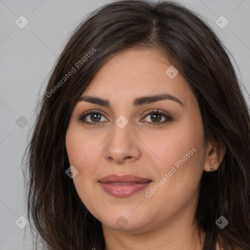 Joyful white young-adult female with long  brown hair and brown eyes