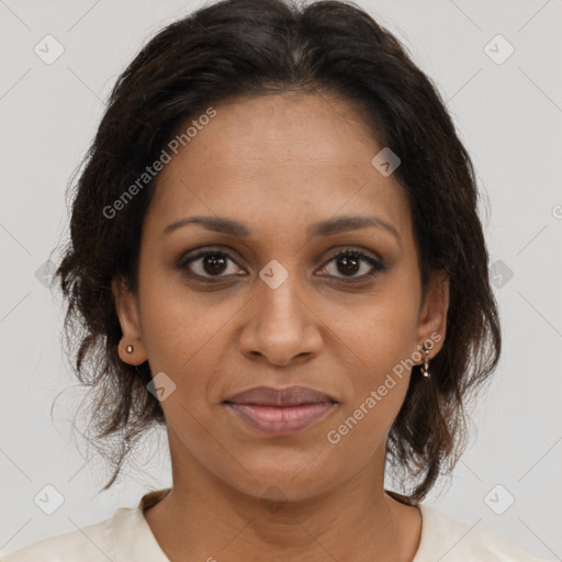 Joyful black young-adult female with medium  brown hair and brown eyes