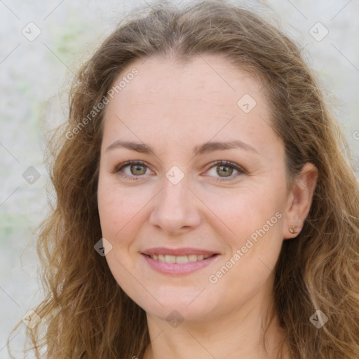 Joyful white young-adult female with long  brown hair and green eyes