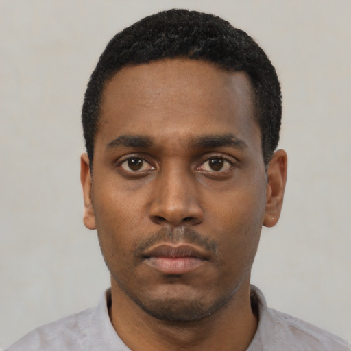 Neutral black young-adult male with short  black hair and brown eyes