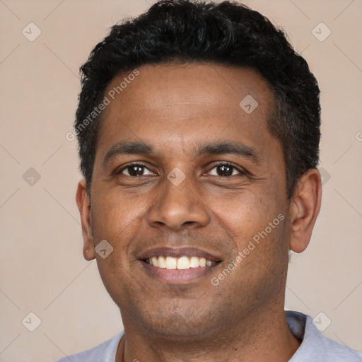 Joyful latino young-adult male with short  black hair and brown eyes