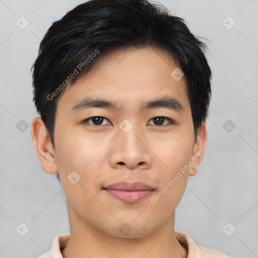 Joyful asian young-adult male with short  black hair and brown eyes