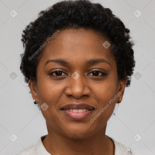 Joyful black young-adult female with short  brown hair and brown eyes