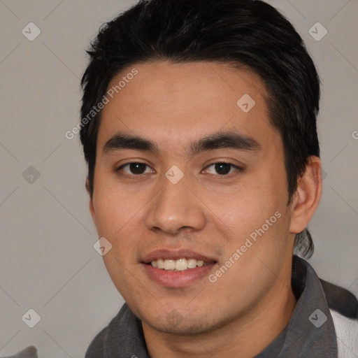 Joyful white young-adult male with short  black hair and brown eyes