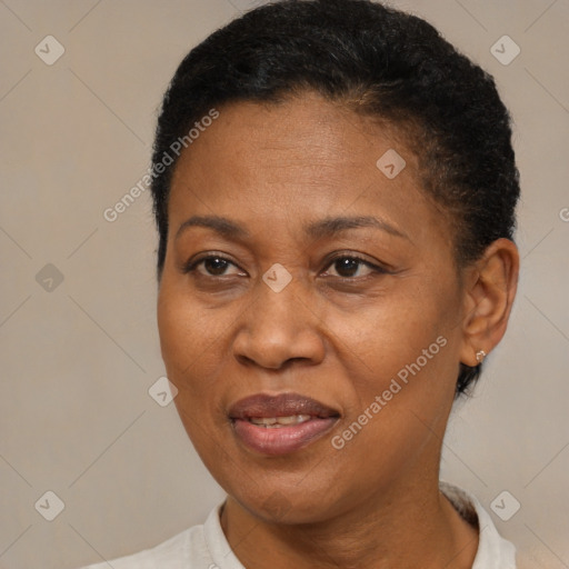 Joyful black adult female with short  brown hair and brown eyes