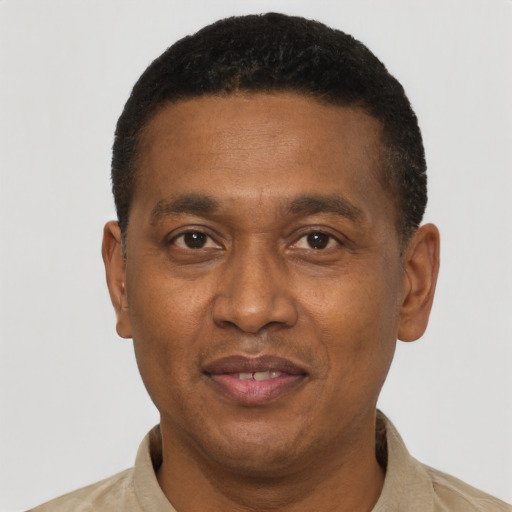 Joyful latino adult male with short  brown hair and brown eyes