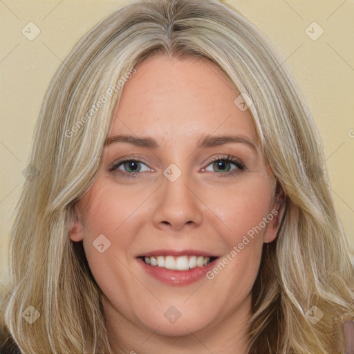 Joyful white young-adult female with long  brown hair and green eyes