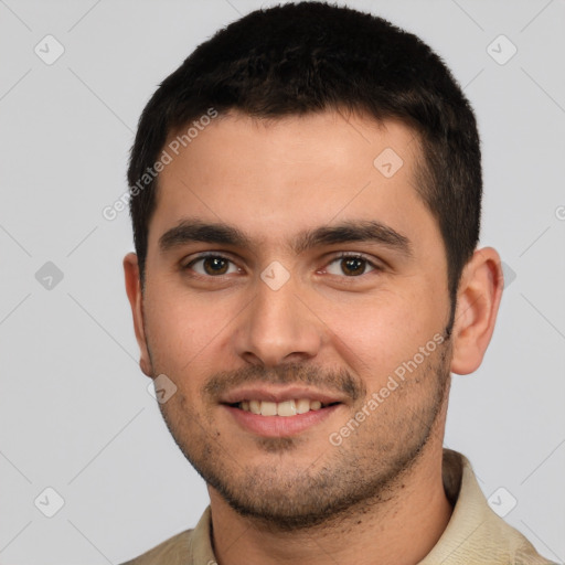 Joyful white young-adult male with short  brown hair and brown eyes