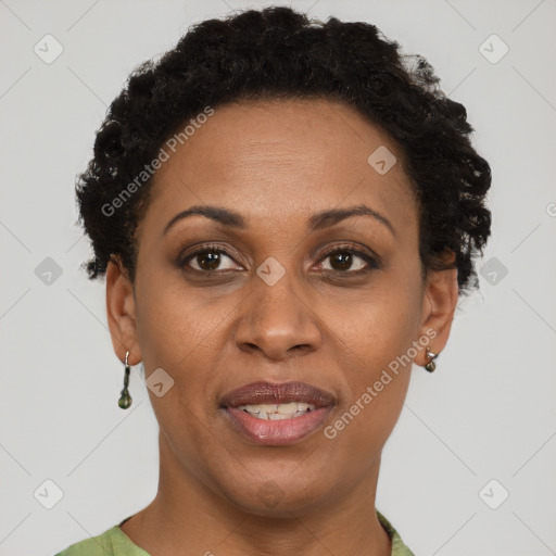 Joyful black adult female with short  brown hair and brown eyes