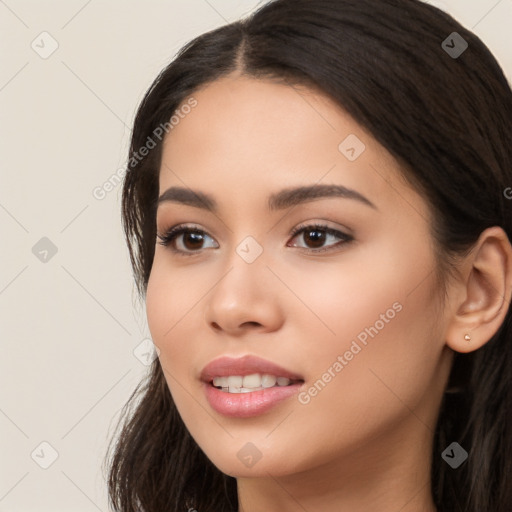 Joyful white young-adult female with long  black hair and brown eyes