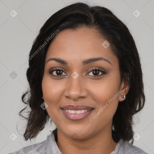 Joyful black young-adult female with medium  brown hair and brown eyes