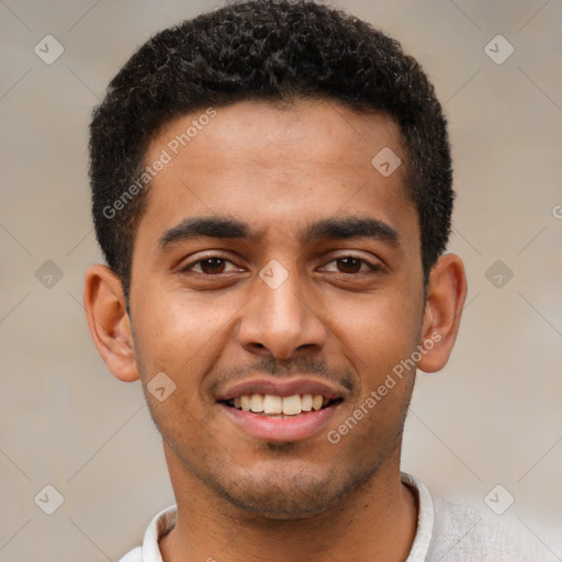 Joyful latino young-adult male with short  black hair and brown eyes