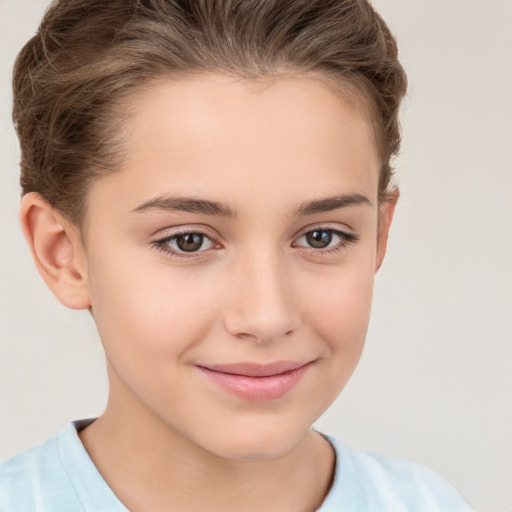 Joyful white child female with short  brown hair and brown eyes