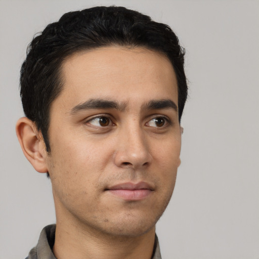 Neutral white young-adult male with short  black hair and brown eyes
