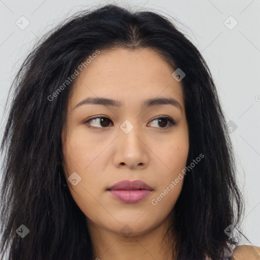 Joyful asian young-adult female with long  brown hair and brown eyes