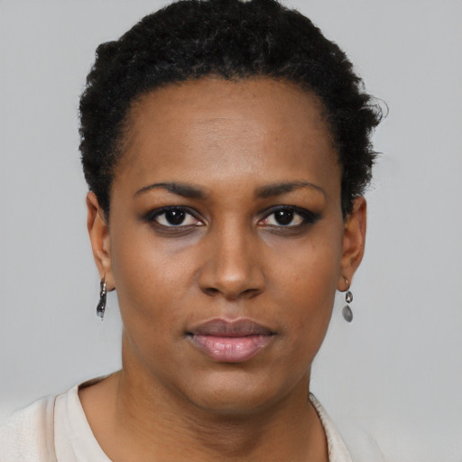 Neutral black young-adult female with short  black hair and brown eyes