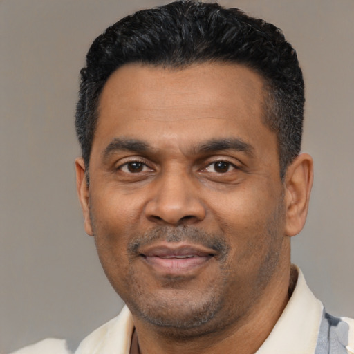 Neutral latino adult male with short  black hair and brown eyes