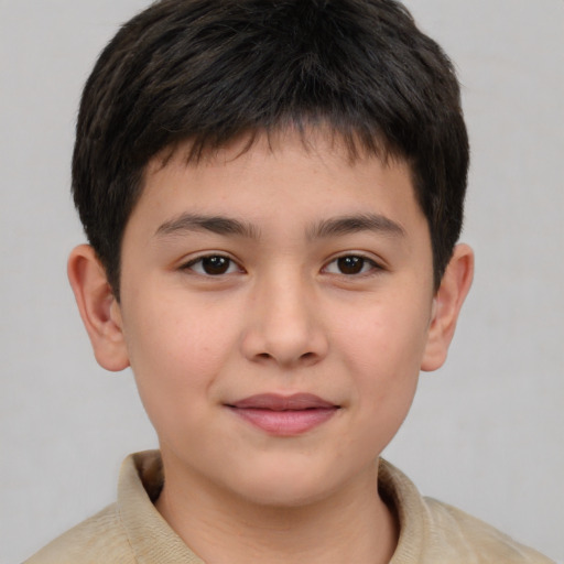 Joyful white child male with short  brown hair and brown eyes