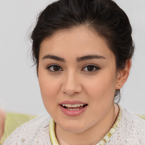 Joyful latino young-adult female with short  brown hair and brown eyes