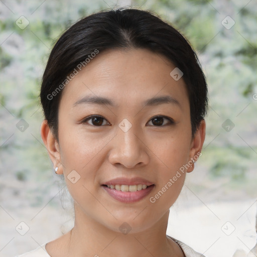 Joyful asian young-adult female with short  brown hair and brown eyes