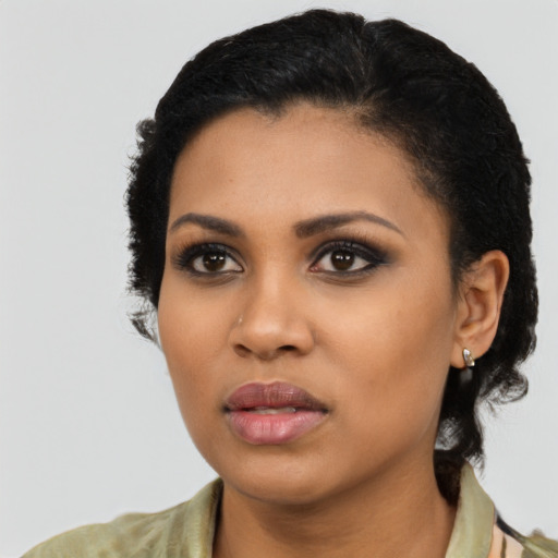 Neutral latino young-adult female with short  black hair and brown eyes
