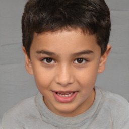 Joyful white child male with short  brown hair and brown eyes