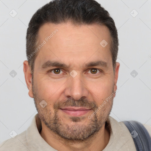 Joyful white adult male with short  brown hair and brown eyes