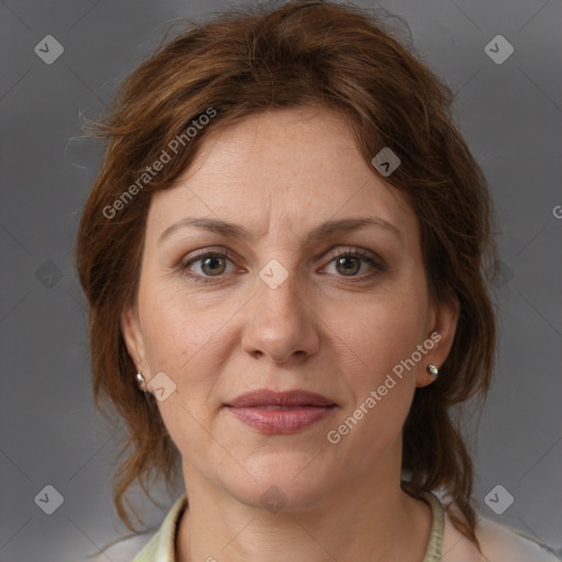 Joyful white adult female with medium  brown hair and grey eyes