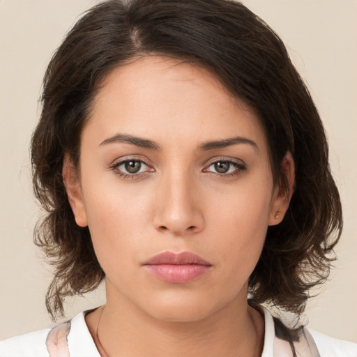 Neutral white young-adult female with medium  brown hair and brown eyes