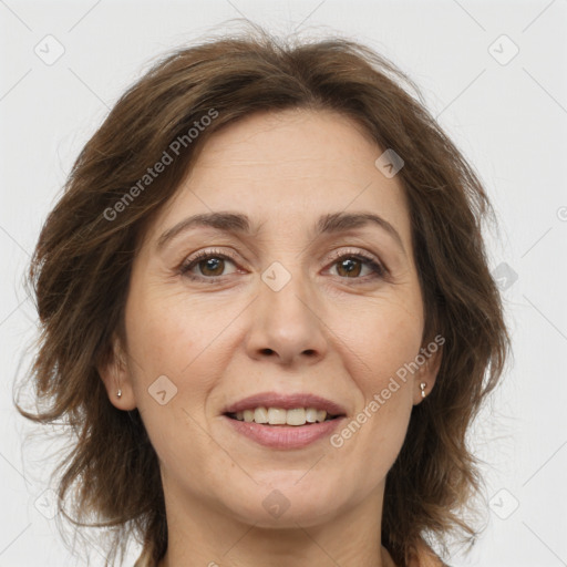 Joyful white adult female with medium  brown hair and brown eyes