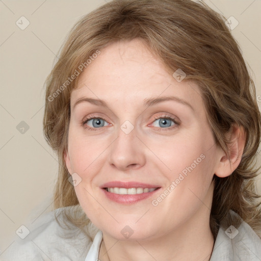 Joyful white young-adult female with medium  brown hair and blue eyes