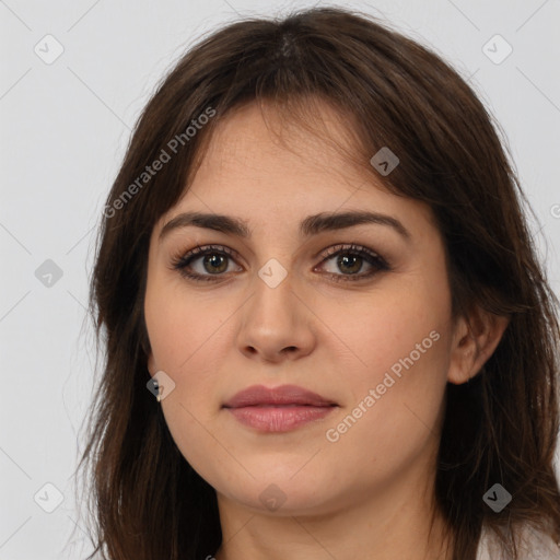 Joyful white young-adult female with long  brown hair and brown eyes